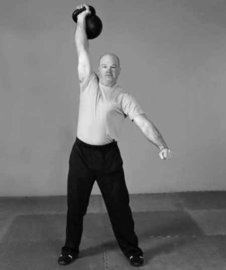 Jon Engum, StrongFirst Certified Master Instructor, performing the one-arm clean & jerk