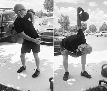 Dr. Moseley performing the kettlebell bent-press